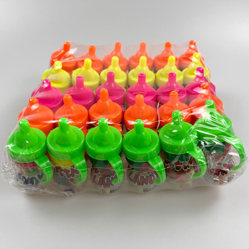 Feeding bottle with nipple shaped sweet fruity multicolored hard candy