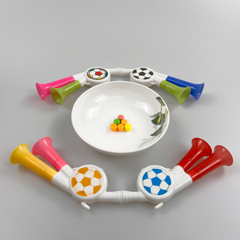 Toy football trumpet with multicolored sweet tasty pressed candy toy candy