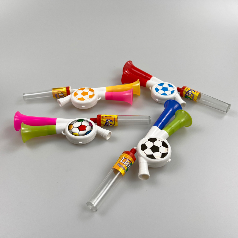 Toy football trumpet with multicolored sweet tasty pressed candy toy candy