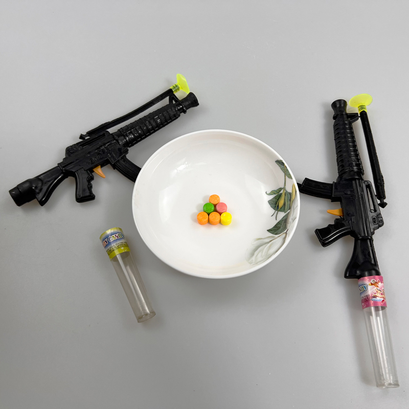 Boys favorite toy gun with multicolored fruity hard pressed candy