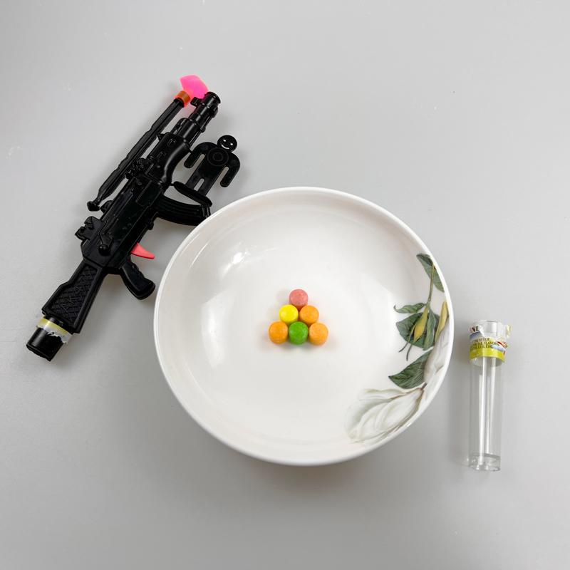 Boys Favorite Ak47 Toy Gun and a Target with Multicolored Fruity Hard Pressed Candy