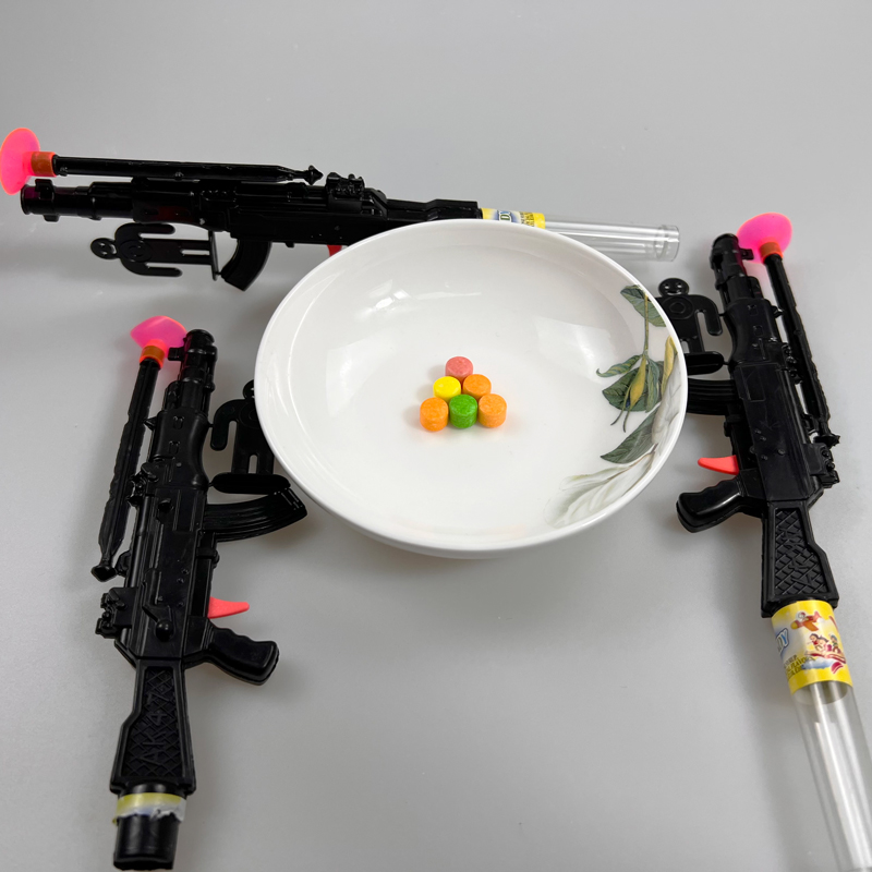 Boys Favorite Ak47 Toy Gun and a Target with Multicolored Fruity Hard Pressed Candy