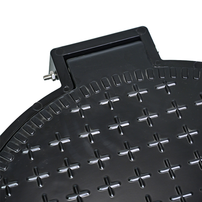 Hinged manhole cover