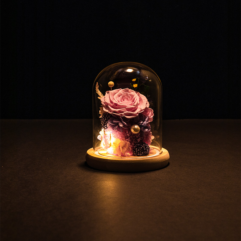 preserved rose in glass dome