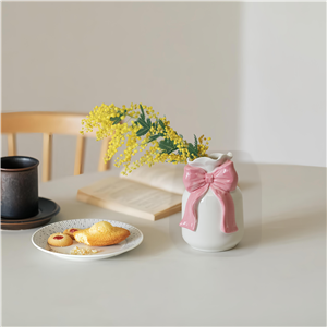 Pink ceramic bow-shaped vase