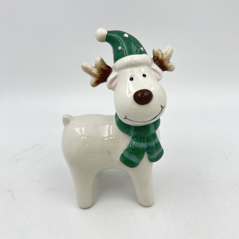 White Ceramic Reindeer Figurine with Green Hat & Scarf | Cute Cartoon Deer Ornament | Glossy Glaze Finish | Christmas Holiday Tabletop Decor