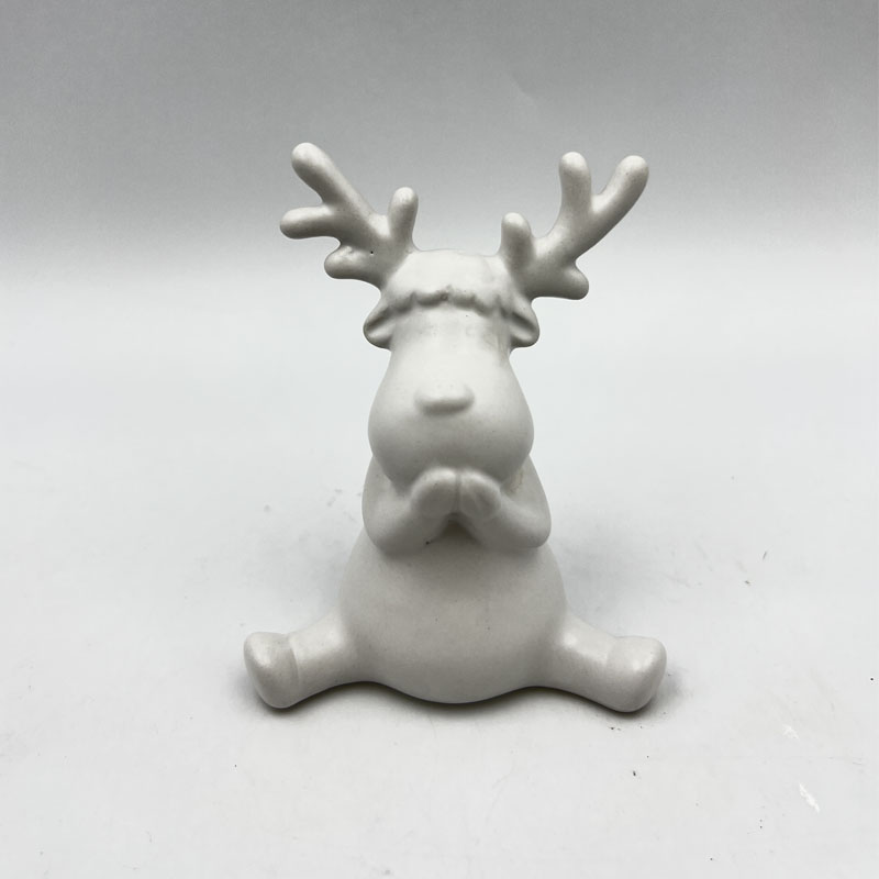 Matte White Sitting Reindeer Figurine with Folded Paws, Cute Ceramic Christmas Tabletop Decor