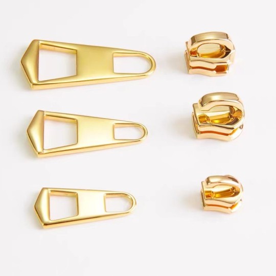 Bevægelig lynlåshoved skydertrækker til håndtaske