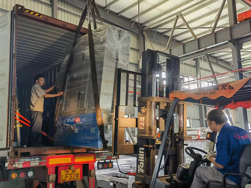 The workers are loading the containers