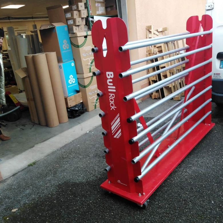 red metal roll display rack