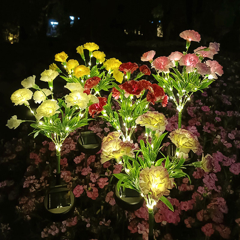 Luci di palo con fiori artificiali solari di garofano