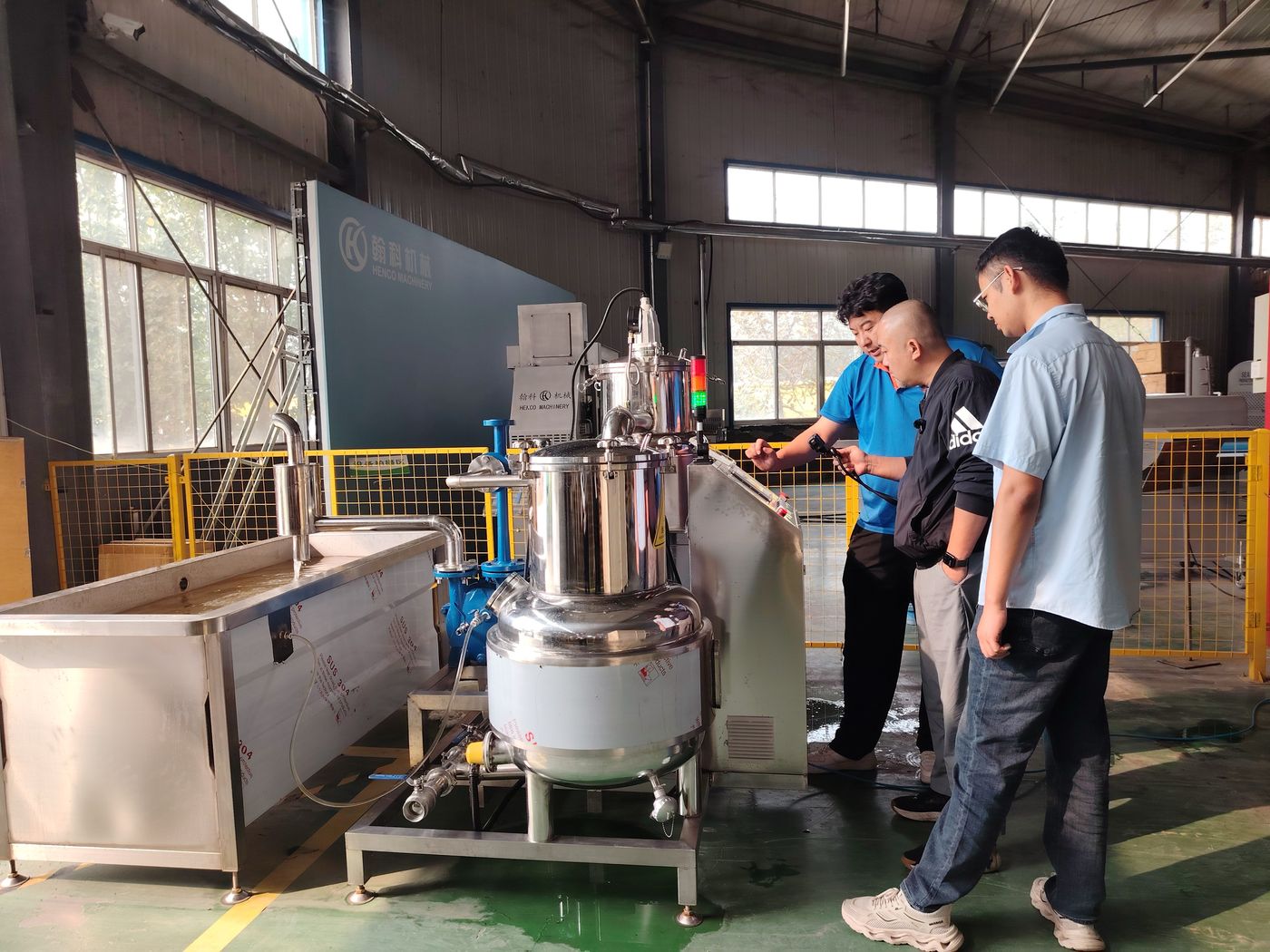 Customer's team watching the machine being explained during factory operator training