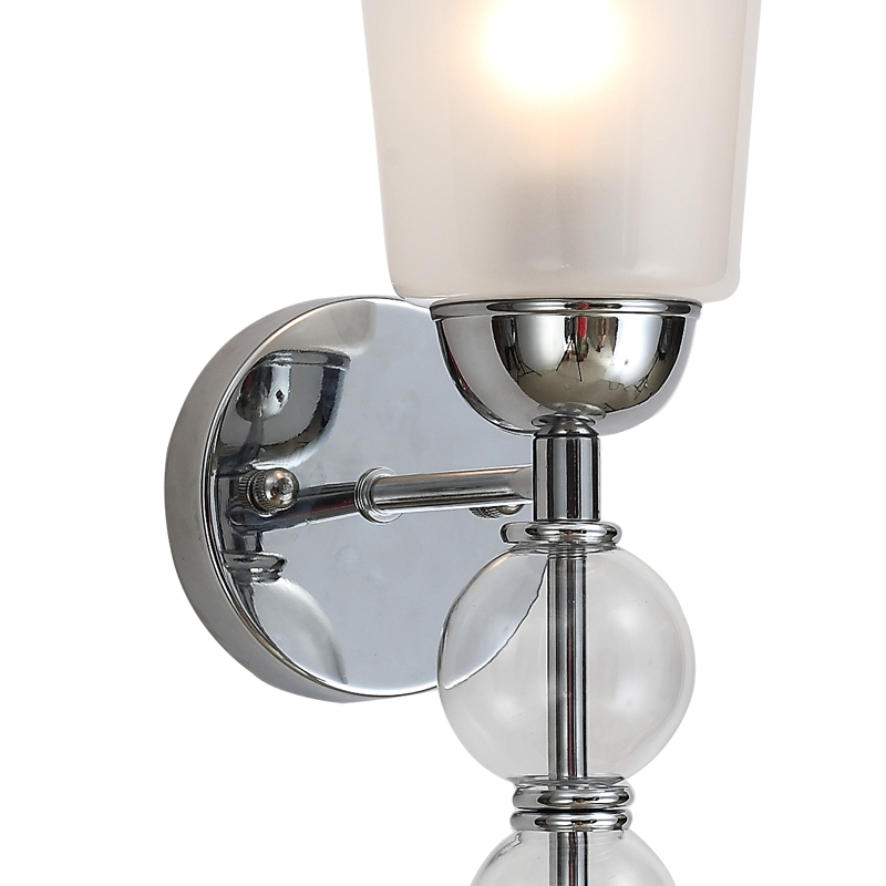 Modern wall lamp with transparent glass, suitable for hallways and bedrooms.