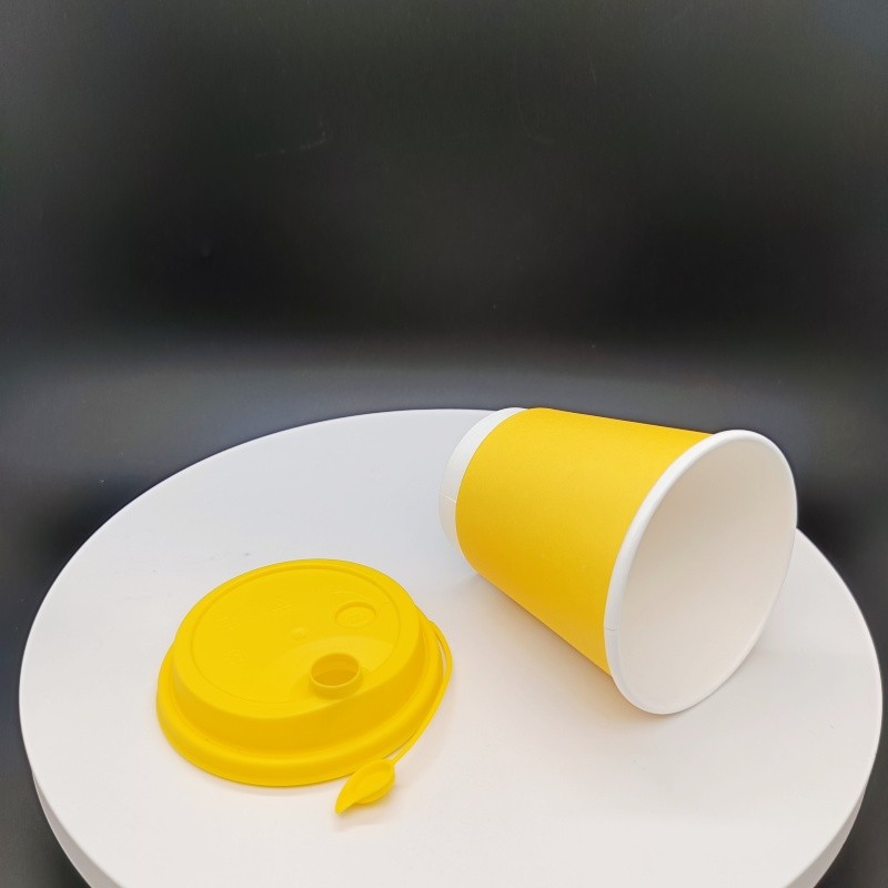 How should 10oz disposable double-walled yellow hot drink paper cups be disposed of properly