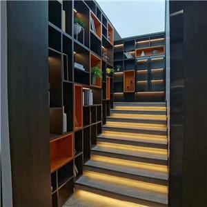 What is the space between library bookcases called?