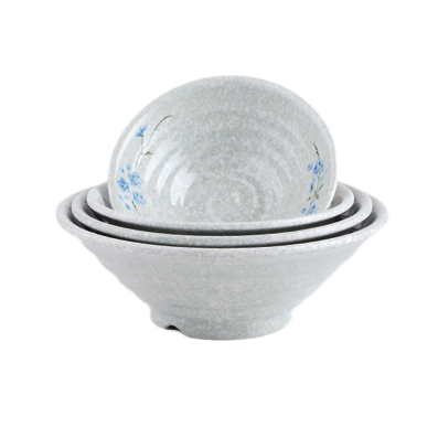 Vajilla de melamina con motivos florales de colores para fiestas al aire libre