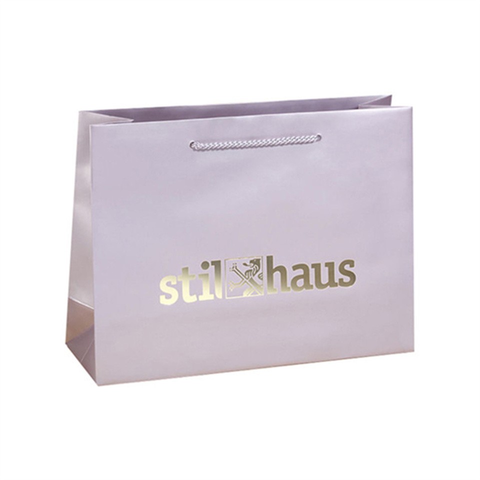 Wholesale competitive price luxury shopping custom paper bags for personalised clothing set