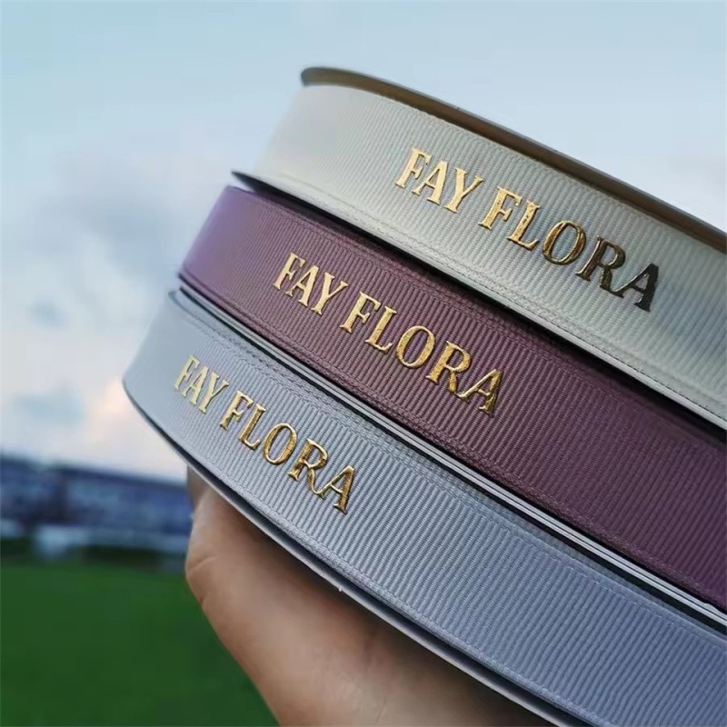 Customized personalized 3D embossed black branded satin ribbon