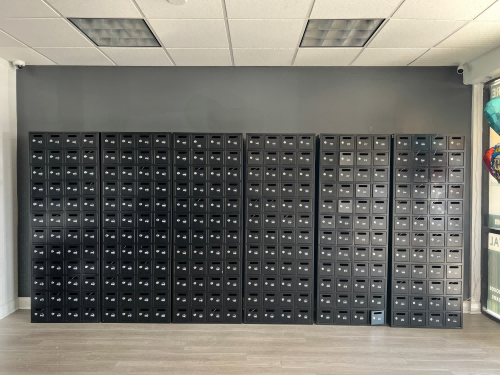 Florida Customer Gives High Praise to Custom Black 48 Door Mailboxes