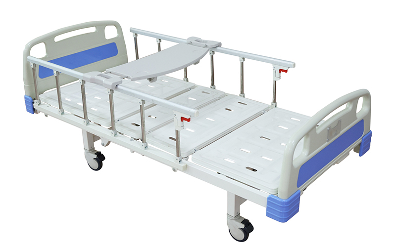 Hospital bed with guardrails