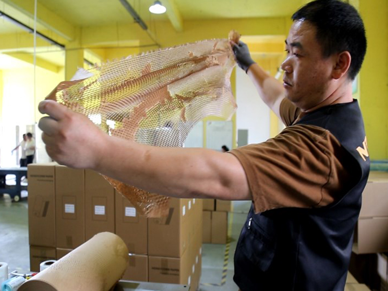 How much labor and packaging costs can a honeycomb paper cutting machine production line help me save?