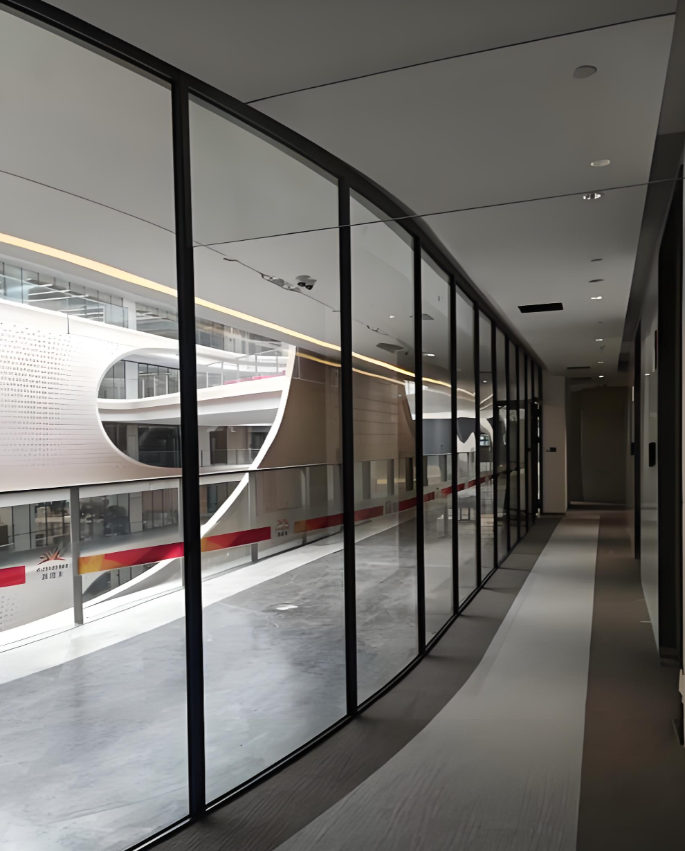 Frameless fire partition system