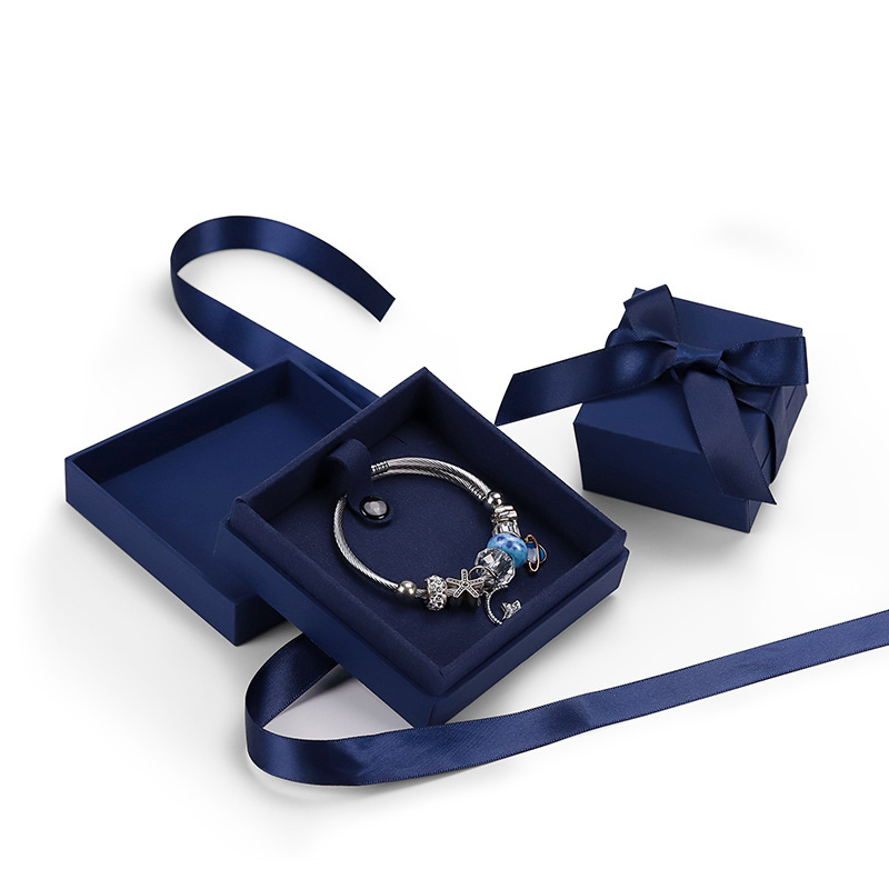 fine blue jewelry paper box with foam ribbon bow