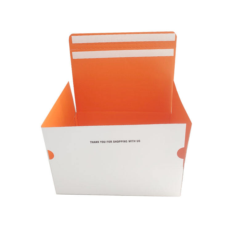 Boîte d'emballage orange pour vêtements avec fermeture éclair et système autobloquant