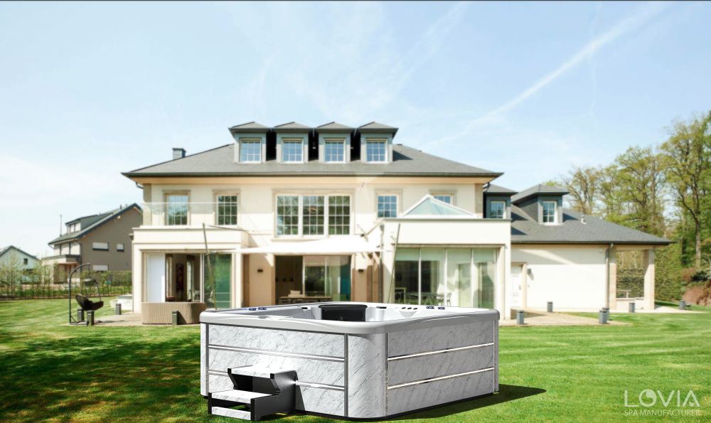 How does an outdoor massage bathtub achieve low noise operation?