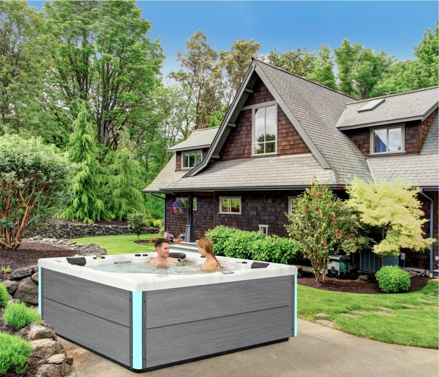 What should I pay attention to when connecting water and electricity in an outdoor hot tub?