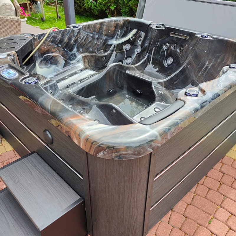 How to remove black mold from the shower head of a massage spa bathtub?