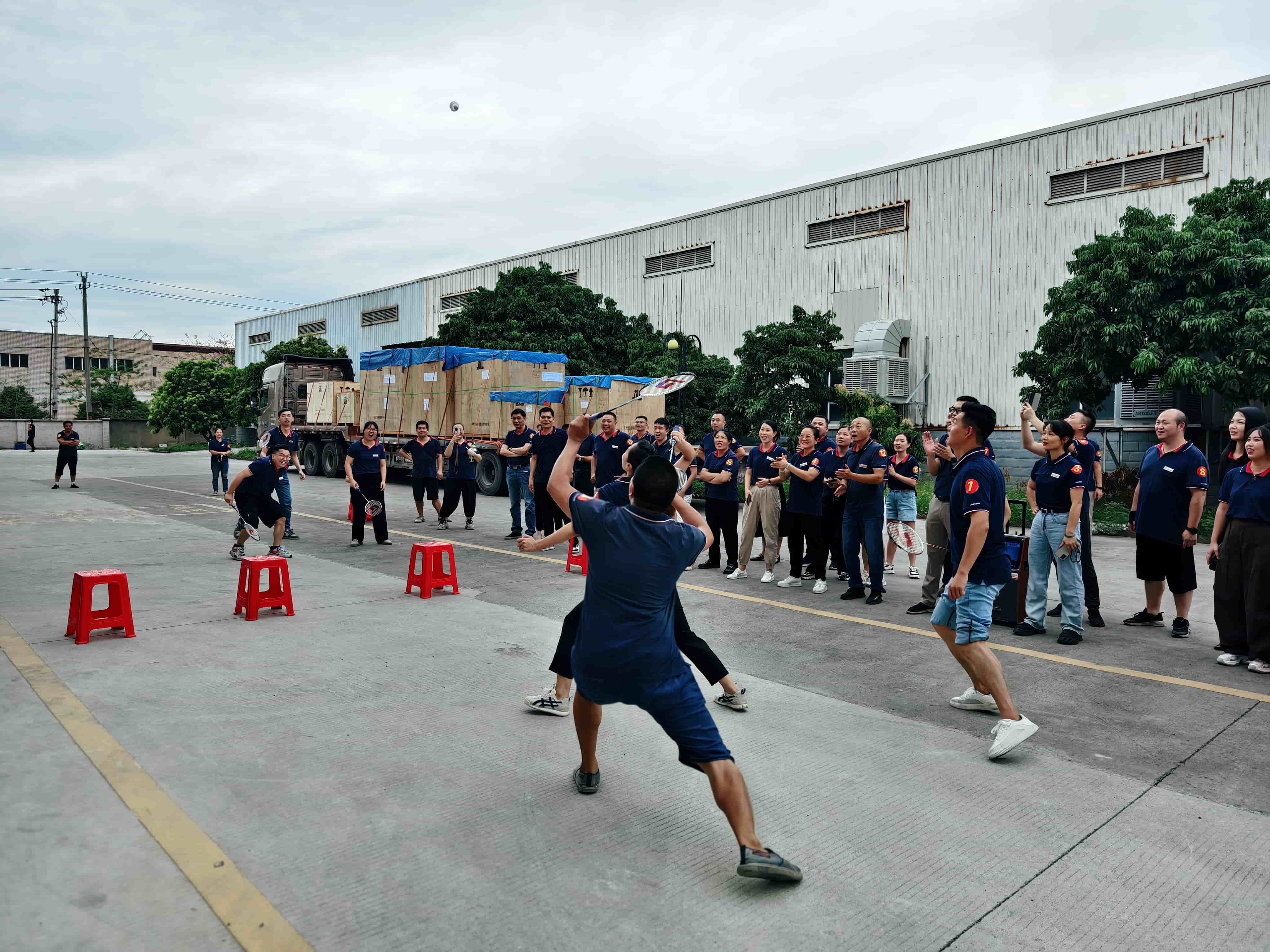 Zhangzhou Jialong employees playing badminton at Mid-Autumn Festival—team for packaging machinery production