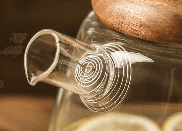 large glass tea pitcher with wooden lid