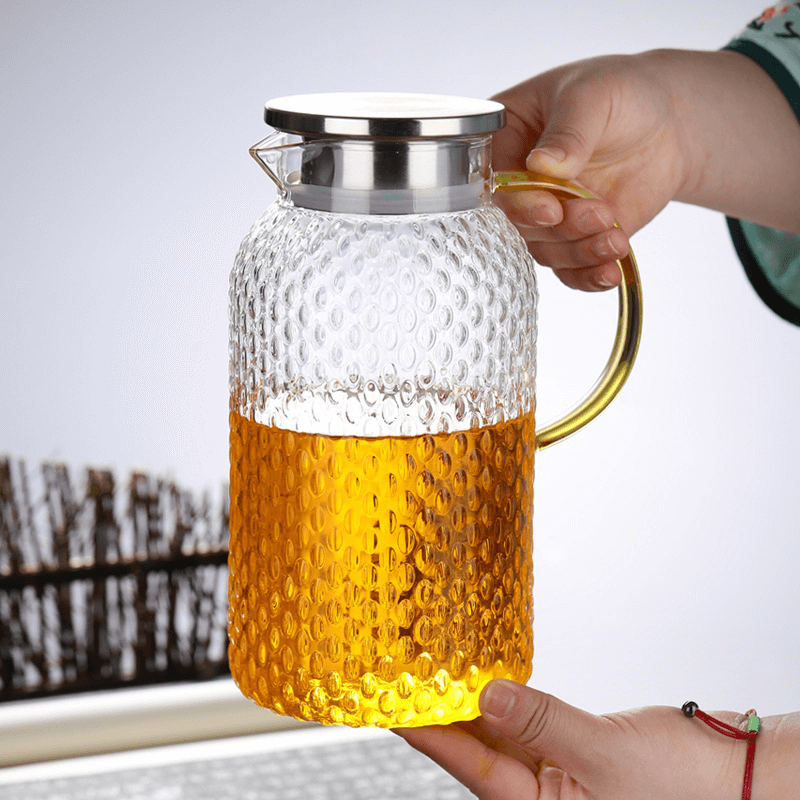 large glass water pitcher with spout