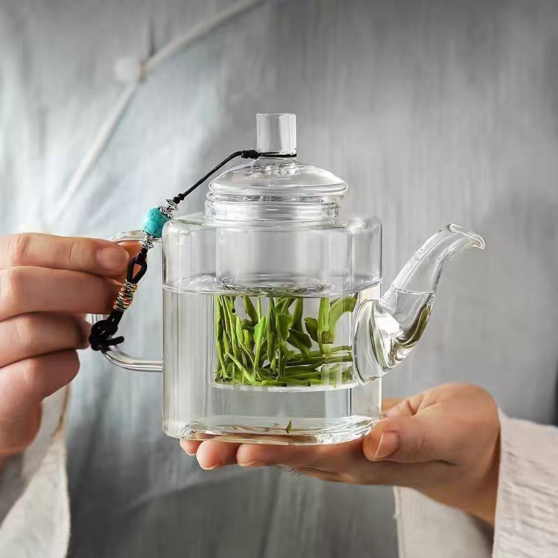 small glass teapot kettle with infuser