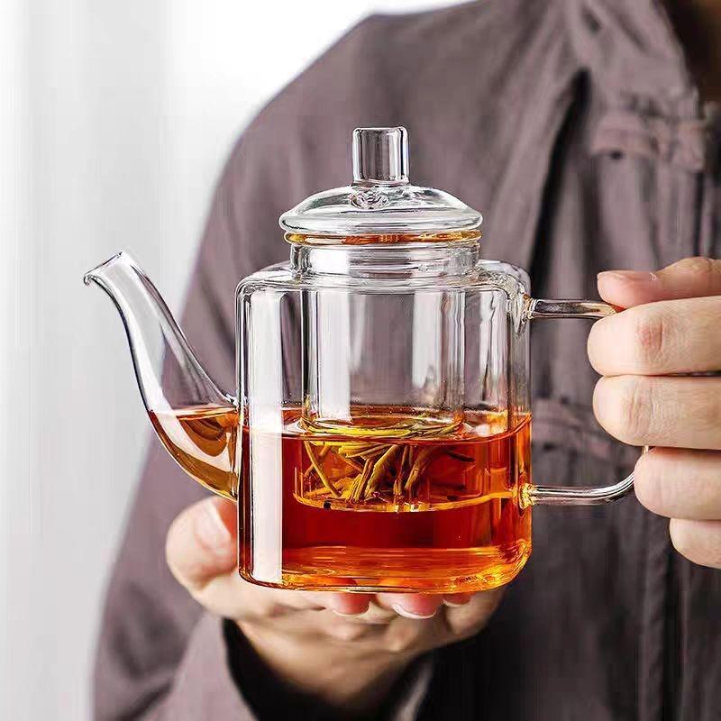 small glass teapot kettle with infuser