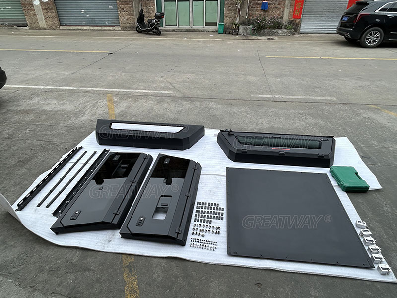 What parts make up a factory-produced pickup truck canopy?