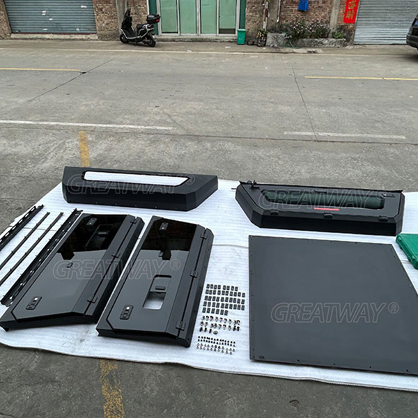 What parts make up a factory-produced pickup truck canopy?