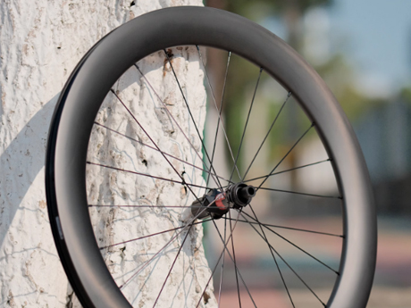 Asymmetric road wheels