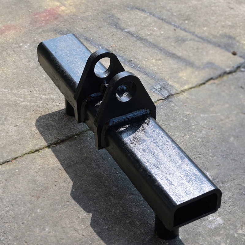 Wheel lifting arm assembly