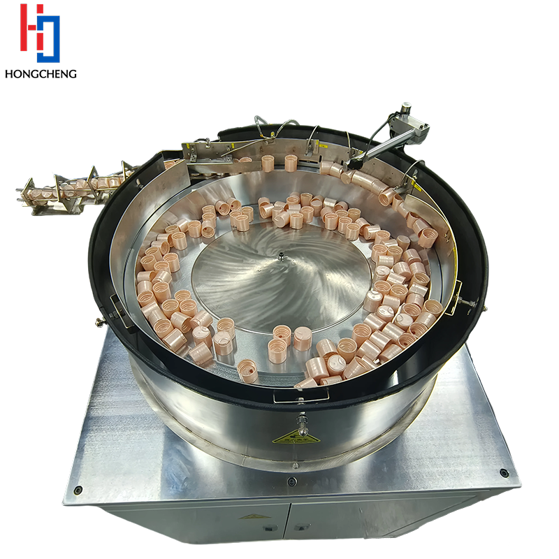 Centrifugal Feeder Orientates & Feeds Caps