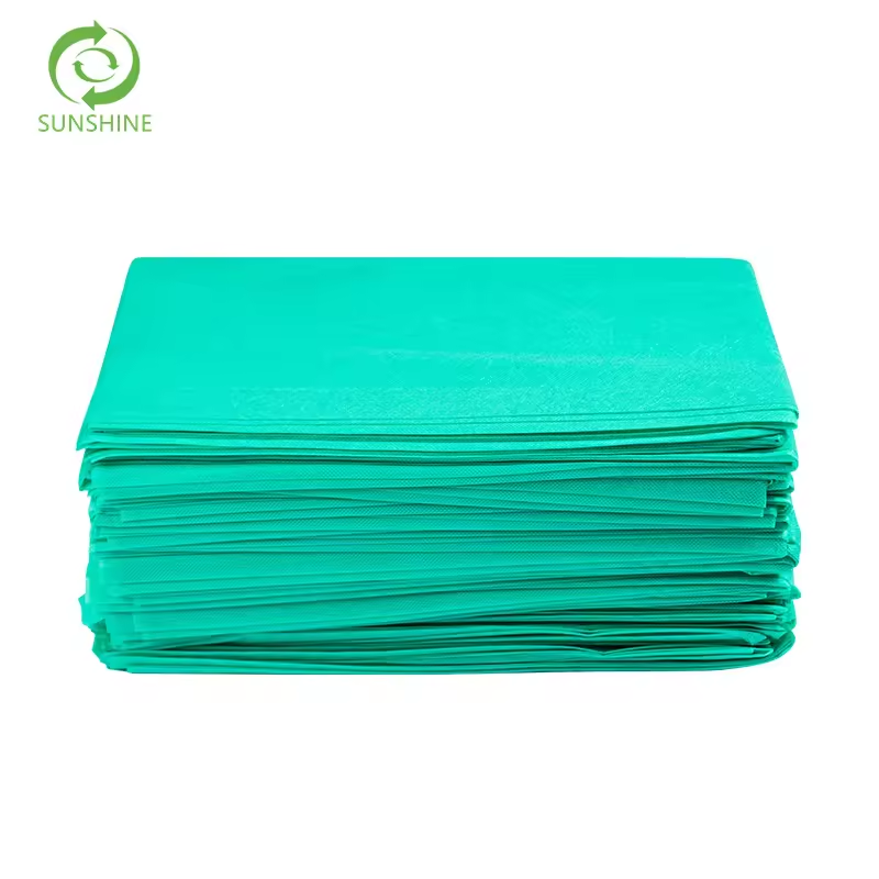 Raw materials for factories disposable nonwoven spunbond fabric 100% polypropylene fabric perforated medical bedsheet insulation