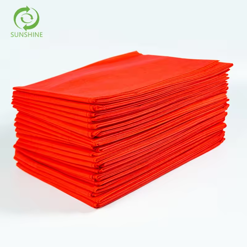 Raw materials for factories disposable nonwoven spunbond fabric 100% polypropylene fabric perforated medical bedsheet insulation