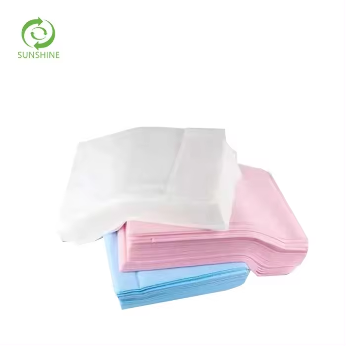 Raw materials for factories disposable nonwoven spunbond fabric 100% polypropylene fabric perforated medical bedsheet insulation