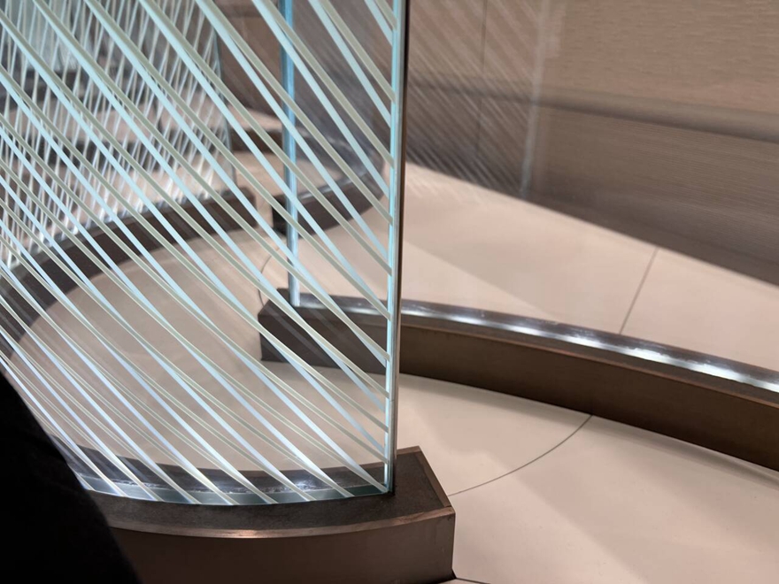 Curved glass partition