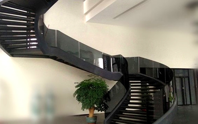 grey tinted curved tempered glass facade