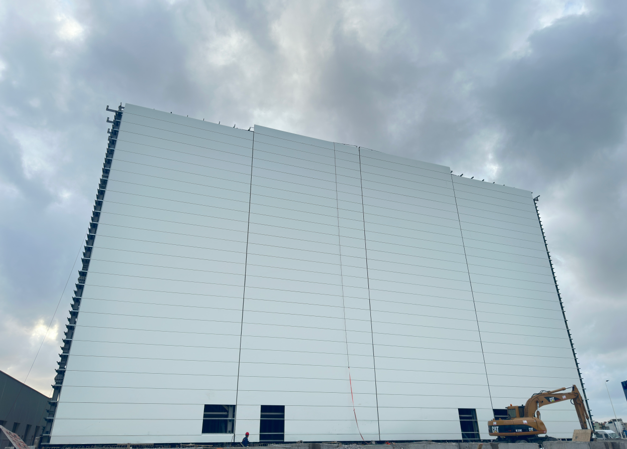 High-rise racking system supporting building envelope High-rise racking system supporting building envelope