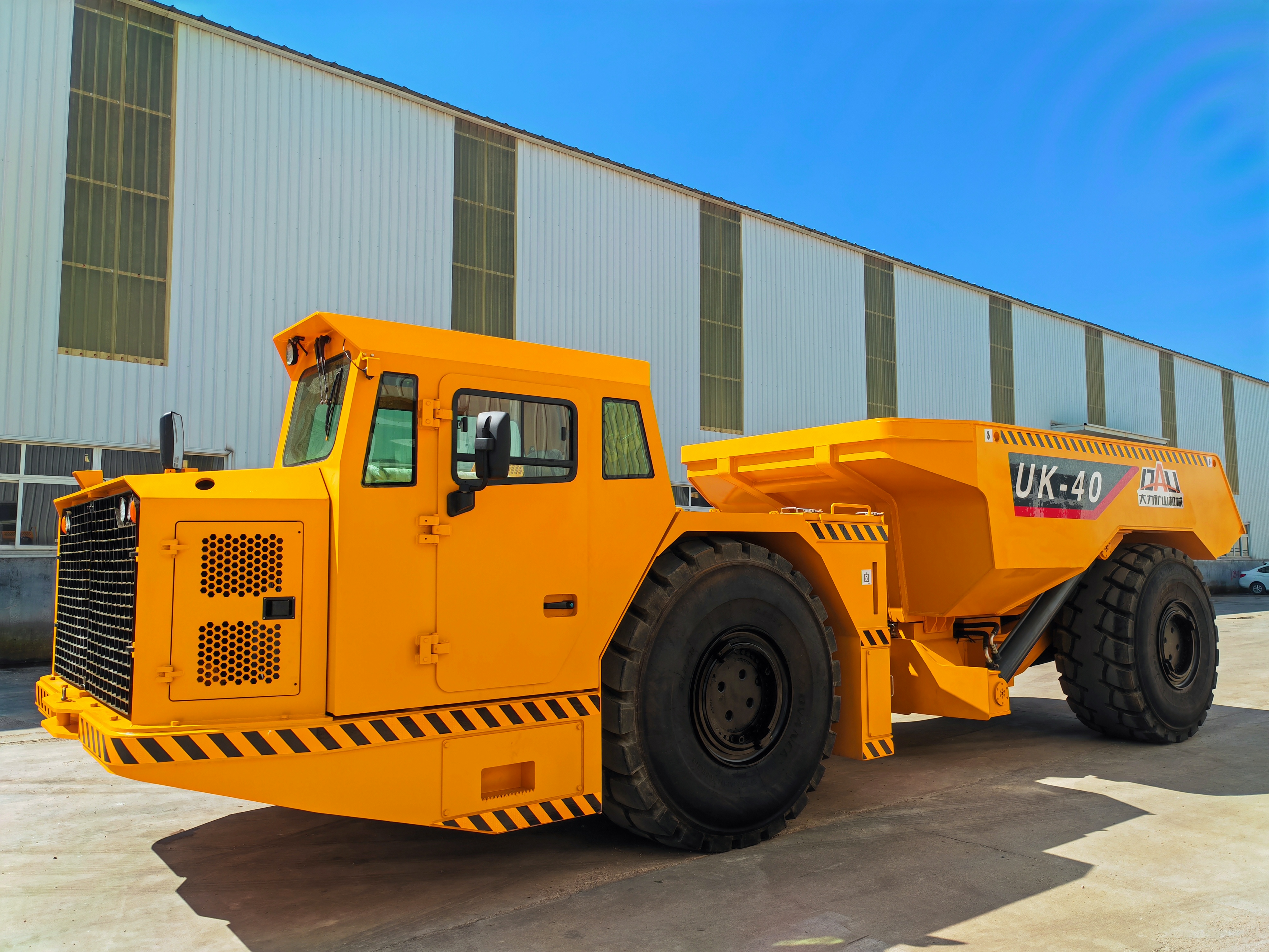 Underground mining loader and trucks