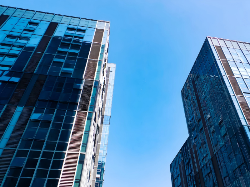 How does laminated glass improve building safety?