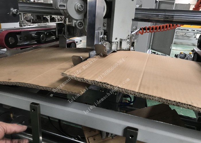 Double piece joint stitcher for heavy corrugated